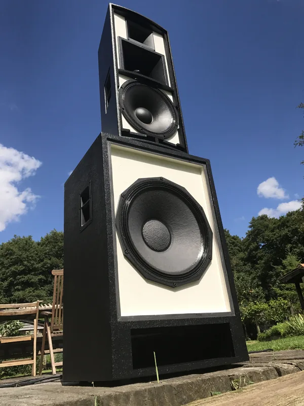 Angled view of a custom black and white MT1581 with the customer’s own subwoofer