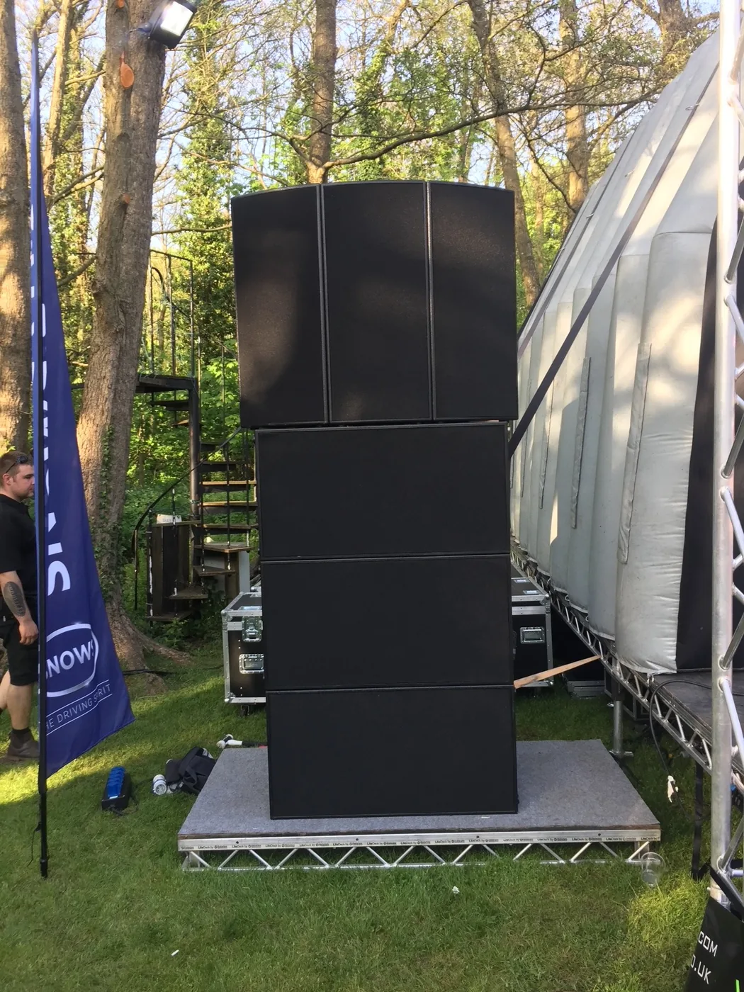 MT1581 and original S218 system beside an outdoor stage